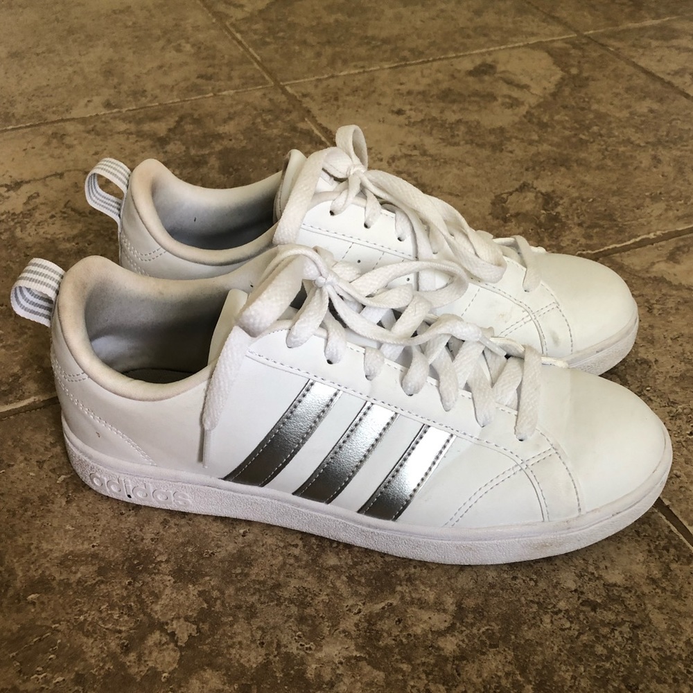Adidas sneakers with silver stripes